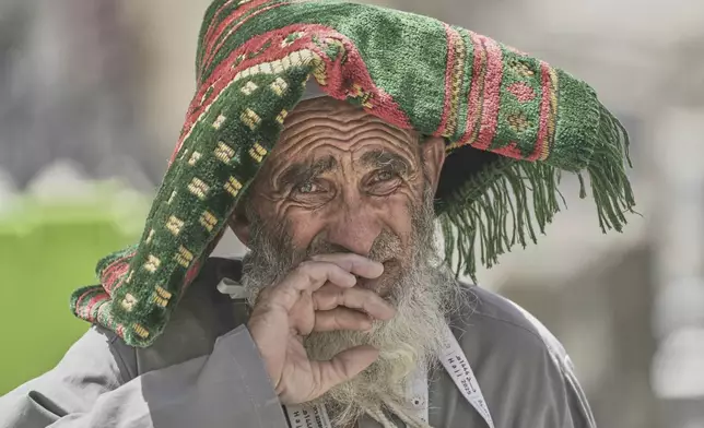 An Afghan Muslim pilgrim, looks on as he prepares to enter the Grand Mosque, during the annual Hajj pilgrimage in Mecca, Saudi Arabia, Monday, June 2, 2025. (AP Photo/Amr Nabi)