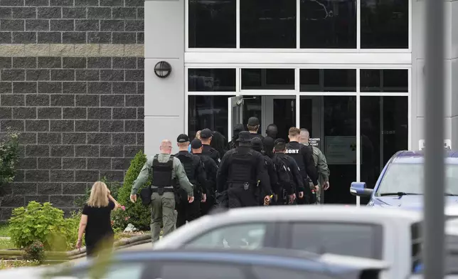 Prison personnel enter the The Trousdale Turner Correctional Center, Monday, June 9, 2025, in Hartsville, Tenn. (AP Photo/George Walker IV)