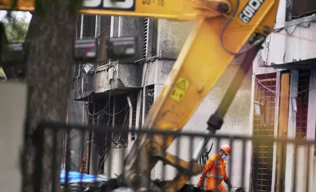 A member of the National Disaster Response Force is seen at Thursday's Air India plane crash site in Ahmedabad, India, Sunday, June 15, 2025. (AP Photo/Ajit Solanki)