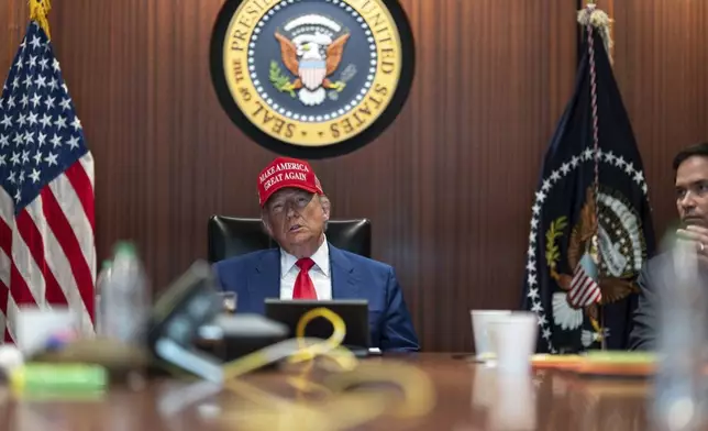 In this image provided by the White House, President Donald Trump and Secretary of State Marco Rubio, right, sit in the Situation Room, Saturday, June 21, 2025, at the White House in Washington. (The White House via AP)