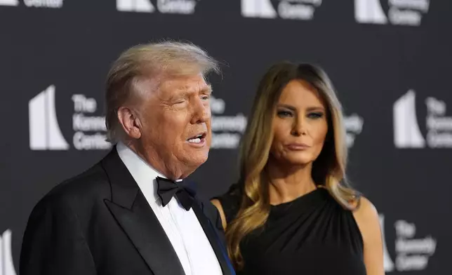 President Donald Trump and first lady Melania Trump arrive to view opening night of "Les Miserables," at the Kennedy Center, Wednesday, June 11, 2025, in Washington. (AP Photo/Alex Brandon)