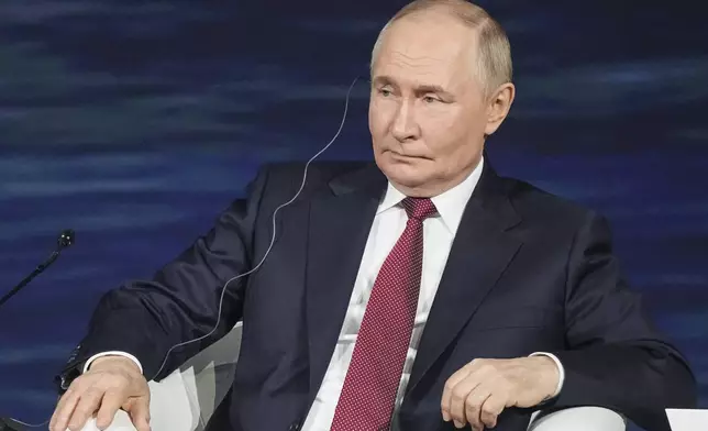 In this photo released by the Roscongress Foundation, Russian President Vladimir Putin attends a plenary session of the St. Petersburg International Economic Forum in St. Petersburg, Russia, Friday, June 20, 2025. (Sergey Shinov/Roscongress Foundation via AP)