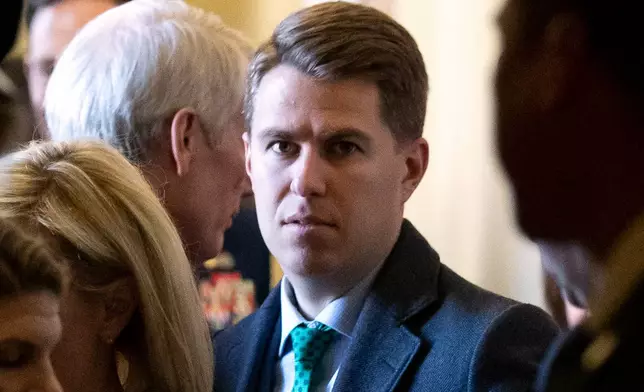 FILE - Homeland Security official Miles Taylor, center, departs after the Republican Caucus luncheon on Capitol Hill, March 5, 2019, in Washington. (AP Photo/Alex Brandon, File)