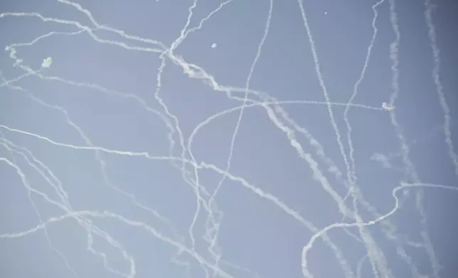 Israeli air defense system fires to intercept missiles during an Iranian attack over Tel Aviv, Israel, Thursday, June 19, 2025. (AP Photo/Leo Correa)