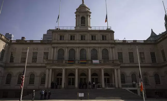 American flag and New York State flag are lowered at half staff while the casket of former Rep. Charles Rangel, D-N.Y., lies in state in the rotunda of New York's City Hall, Thursday, June 12, 2025. (AP Photo/Yuki Iwamura)