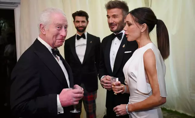 FILE - Britain's King Charles III speaks with David Beckham and Victoria Beckham during a dinner at Highgrove House, Tetbury, England, Friday Feb. 7, 2025. (Finnbarr Webster/Pool via AP, File)