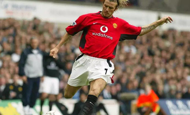 FILE - Manchester United's and England international David Beckham fires over a cross against Tottenham Hotspur during their English Premier League soccer match at Tottenham's White Hart Lane ground in London, April 27, 2003. (AP Photo/Alastair Grant, File)
