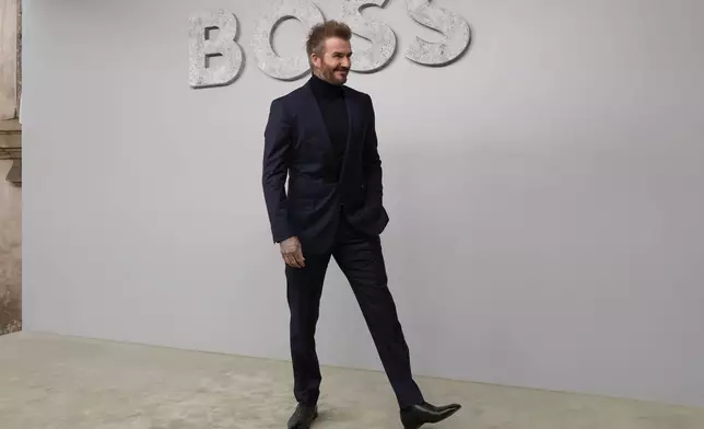 FILE - Former soccer star David Beckham attends the Boss Spring Summer 2025 fashion show, that was presented in Milan, Italy, Wednesday, Sept. 18, 2024. (AP Photo/Antonio Calanni, File)