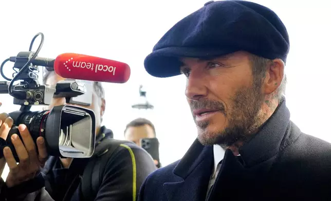 FILE - David Beckham speaks to the media after leaving Westminster Palace where he paid respects to the late Queen Elizabeth II, at Westminster Hall, London, England, Friday, Sept. 16, 2022. (AP Photo/Markus Schreiber, File)