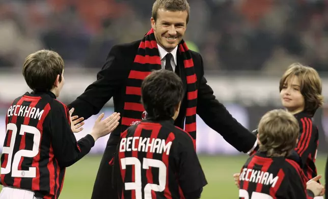 FILE - British soccer star David Beckham smiles prior to the start of a Serie A soccer match between AC Milan and Udinese at the San Siro stadium in Milan, Italy, Sunday, Dec. 21, 2008. (AP Photo/ Antonio Calanni, File)