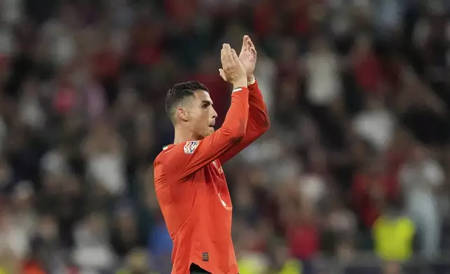Portugal's Cristiano Ronaldo applauds as he leaves the pitch to be substituted during the Nations League semifinal soccer match between Portugal and Germany at the Munich Football Arena, in Munich, Germany, Wednesday, June 4, 2025. (AP Photo/Martin Meissner)