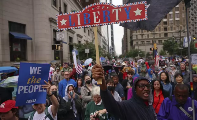 Demonstrators march during the "No Kings" protest, Saturday, June 14, 2025, in Philadelphia. (AP Photo/Yuki Iwamura)