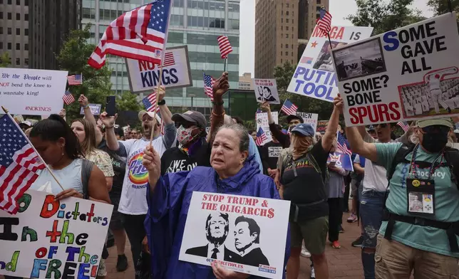 People gather at Love Park during the "No Kings" protest, Saturday, June 14, 2025, in Philadelphia. (AP Photo/Yuki Iwamura)