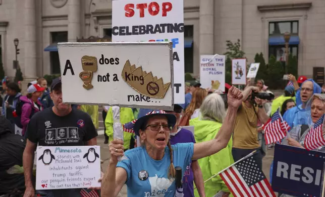 Demonstrators participate in the "No Kings" protest, Saturday, June 14, 2025, in Philadelphia. (AP Photo/Yuki Iwamura)