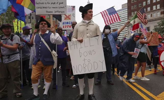 Steven Pierce, center, participates in the "No Kings" protest, Saturday, June 14, 2025, in Philadelphia. (AP Photo/Yuki Iwamura)