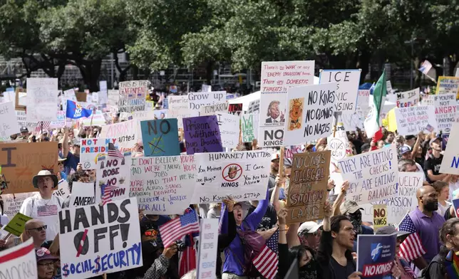 People gather at the "No Kings" nationwide demonstration on Saturday, June 14, 2025 in Houston. (Raquel Natalicchio/Houston Chronicle via AP)
