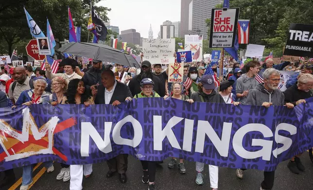 Arndrea Waters King, third from left, and Martin Luther King III, fourth from left, march in the "No Kings" protest, Saturday, June 14, 2025, in Philadelphia. (AP Photo/Yuki Iwamura)