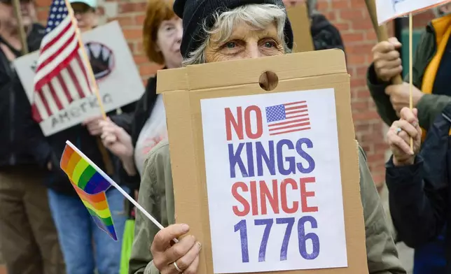 Several hundred gather outside of the train station in Bellows Falls, Vt., to show support for the third annual Pride Whistle-Stop Tour, that also encompassed people participating in the "No Kings" protest, Saturday, June 14, 2025, as the Amtrak Vermonter travels from St. Albans south to Brattleboro. (Kristopher Radder/The Brattleboro Reformer via AP)