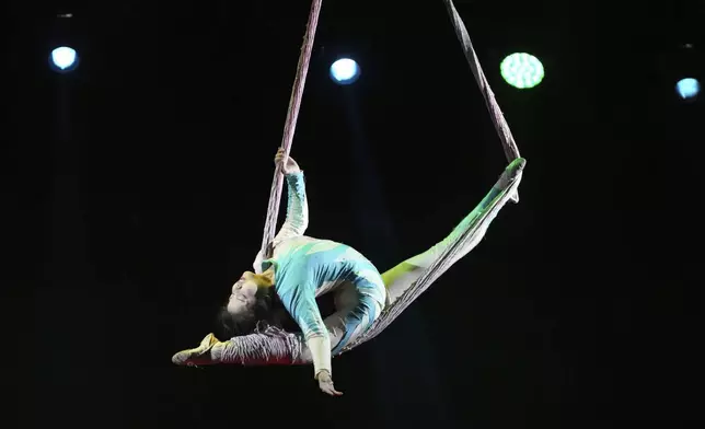 An acrobat from Dongchoon Circus Troupe which South Korea's last-remaining circus, performs during a daily regular performance in Ansan, South Korea, Wednesday, June 11, 2025. (AP Photo/Lee Jin-man)