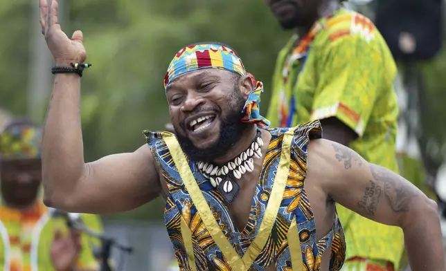 Nii Osenda of the Akwaaba Ensemble dances during a Juneteenth celebration at the African Burying Ground Memorial Park Thursday, June 19, 2025, in Portsmouth, N.H. (AP Photo/Michael Dwyer)