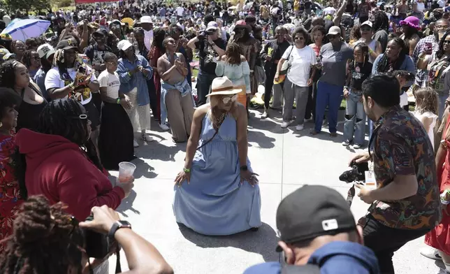 People dance as the DJ plays at the Juneteenth Celebration at the Oakland Museum of California on Thursday, June 19, 2025.(Richard H. Grant/San Francisco Chronicle via AP)