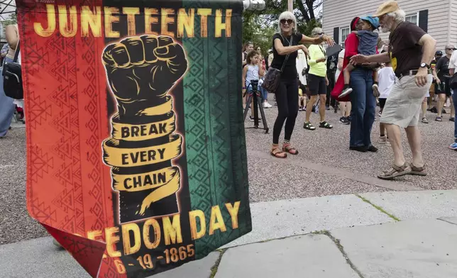 People dance to Akwaaba Ensemble during a Juneteenth celebration at the African Burying Ground Memorial Park Thursday, June 19, 2025, in Portsmouth, N.H. (AP Photo/Michael Dwyer)