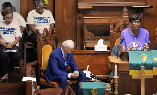 Former President Joe Biden bows his head in prayer during a Juneteenth event at the Reedy Chapel AME Church, Thursday, June 19, 2025, in Galveston, Texas. (AP Photo/David J. Phillip)
