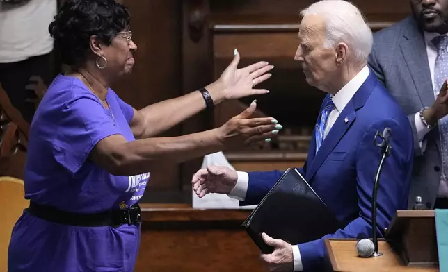 Former President Joe Biden gets a hug from Rev. Lernette (People) Patterson after speaking at a Juneteenth event at the Reedy Chapel AME Church, Thursday, June 19, 2025, in Galveston, Texas. (AP Photo/David J. Phillip)