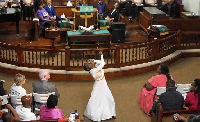 Jaala Martin dances as Former President Joe Biden watches during a Juneteenth event at the Reedy Chapel AME Church, Thursday, June 19, 2025, in Galveston, Texas. (AP Photo/David J. Phillip)