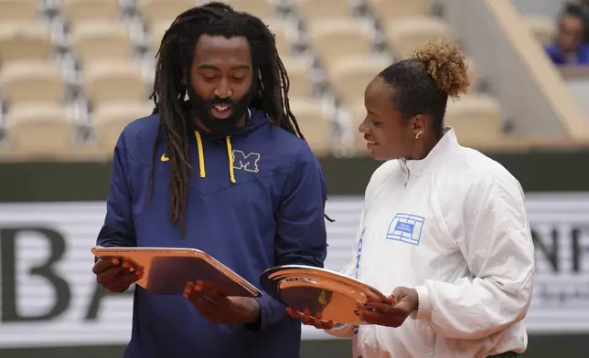 Second placed Taylor Townsend and Evan King of the U.S. hold trophies after the mixed doubles final match of the French Tennis Open against winners Italy's Sara Errani and Andrea Vavassori at the Roland-Garros stadium in Paris, Thursday, June 5, 2025. (AP Photo/Aurelien Morissard)