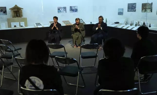 Masatsugu Tanimoto, from left, Yoshitaka Oishi and Yoshinori Yamamoto chant Orasho, recitation of Latin chants, in the Ikitsuki Island Museum "Shima no Yakata" at Ikitsuki Island in Hirado, southern Japan, Tuesday, April 29, 2025. (AP Photo/Hiro Komae)