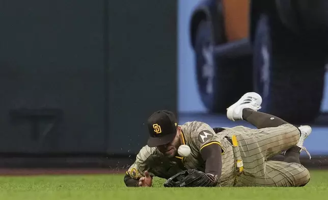 San Diego Padres left fielder Brandon Lockridge is unable to catch a double hit by San Francisco Giants' Jung Hoo Lee during the sixth inning of a baseball game Wednesday, June 4, 2025, in San Francisco. (AP Photo/Godofredo A. Vásquez)