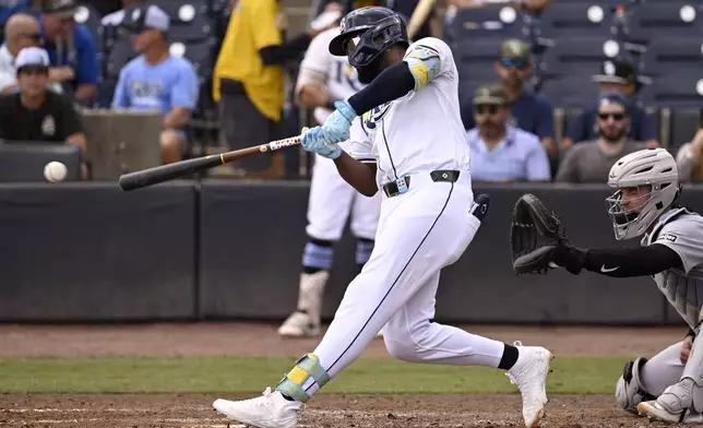 Tampa Bay Rays' Junior Caminero singles during the sixth inning of a baseball game against the Detroit Tigers, Sunday, June 22, 2025, in Tampa, Fla. (AP Photo/Jason Behnken)