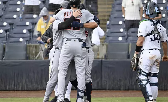 Tampa Bay Rays catcher Matt Thaiss (34) looks away as Detroit Tigers' Parker Meadows celebrates his three-run home run during the ninth inning of a baseball game against the Tampa Bay Rays, Sunday, June 22, 2025, in Tampa, Fla. (AP Photo/Jason Behnken)