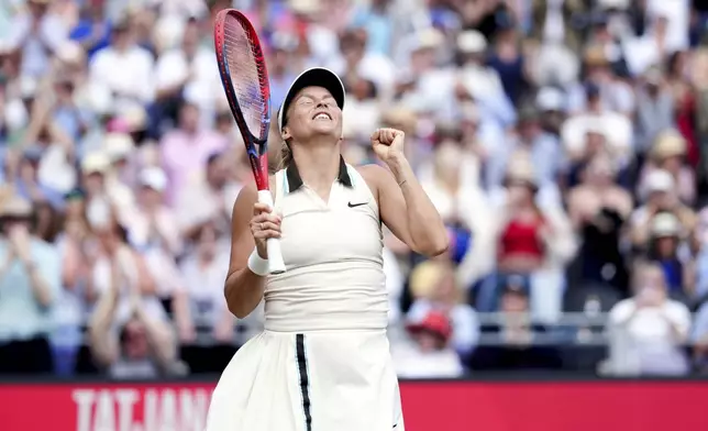 Germany's Tatjana Maria celebrates following her semifinal match against Madison Keys of the U.S. on day six of the HSBC Championships at The Queen's Club, London, Saturday June 14, 2025. (John Walton/PA via AP)