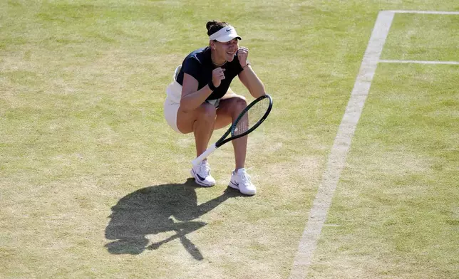 Amanda Anisimova of the U.S. reacts after winning her semifinal match against China's Qinwen Zheng on day six of the HSBC Championships at The Queen's Club, London, Saturday June 14, 2025. (John Walton/PA via AP)