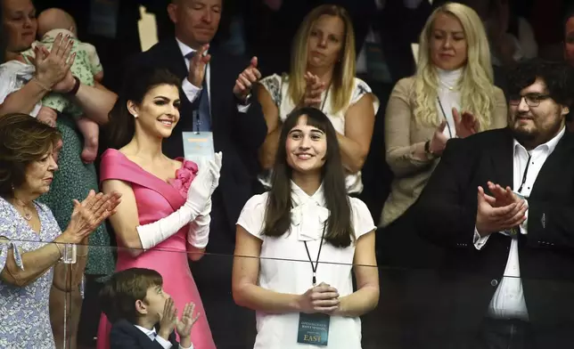 FILE - Chloe Cole, center, is recognized by Florida Gov. Ron DeSantis during a joint session for his State of the State speech at the Capitol in Tallahassee, Fla., March 7, 2023. Cole received puberty blockers when she was 13, and underwent a double mastectomy at 15. Now she is an advocate against allowing those procedures on children. (AP Photo/Phil Sears, File)
