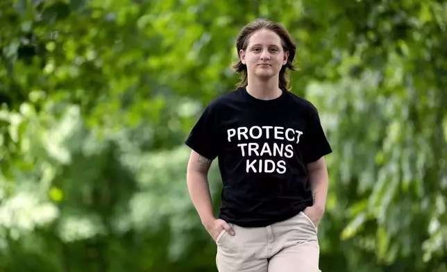 Eli Givens walks in a park Wednesday, June 18, 2025, in Franklin, Tenn., after the Supreme Court upheld Tennessee's ban on gender-affirming care for transgender minors. (AP Photo/Mark Humphrey)