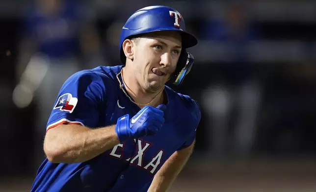 Texas Rangers' Wyatt Langford watches his RBI single off Tampa Bay Rays pitcher Pete Fairbanks during the ninth inning of a baseball game Wednesday, June 4, 2025, in Tampa, Fla. (AP Photo/Chris O'Meara)