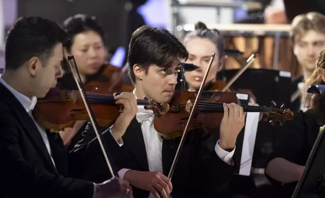 Members of the Vienna Symphony Orchestra perform "The Blue Danube" waltz as it is transmitted into deep space towards Voyager 1. in Vienna, Austria, on Saturday, May 31, 2025. (AP Photo/Denes Erdos)