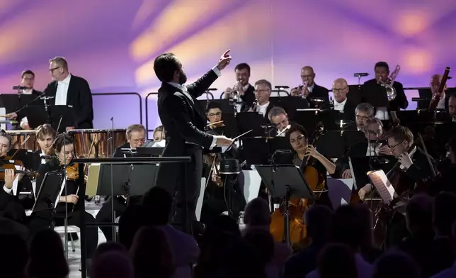Members of the Vienna Symphony Orchestra perform "The Blue Danube" waltz as it is transmitted into deep space towards Voyager 1. in Vienna, Austria, on Saturday, May 31, 2025. (AP Photo/Denes Erdos)