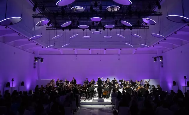 Members of the Vienna Symphony Orchestra perform "The Blue Danube" waltz as it is transmitted into deep space towards Voyager 1. in Vienna, Austria, on Saturday, May 31, 2025. (AP Photo/Denes Erdos)