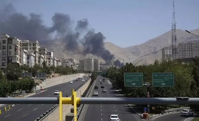 Smoke rises from an oil storage facility after it appeared to have been struck by an Israeli strike on Saturday, in Tehran, Iran, Monday, June 16, 2025. (AP Photo/Vahid Salemi)
