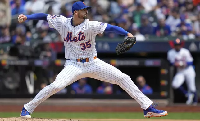 New York Mets pitcher Clay Holmes throws during the third inning of a baseball game against the Colorado Rockies, Sunday, June 1, 2025, in New York. (AP Photo/Seth Wenig)