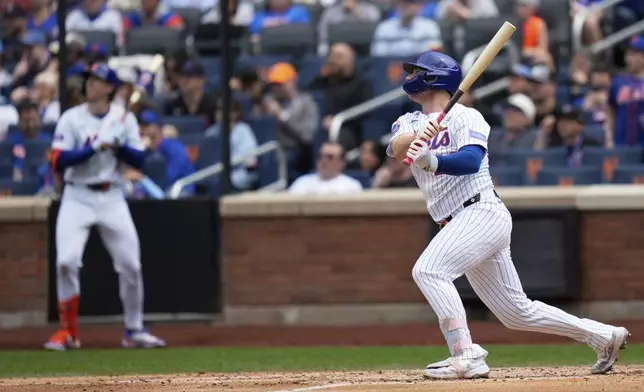 New York Mets' Pete Alonso looks after his three-run homer during the fourth inning of a baseball game against the New York Mets, Sunday, June 1, 2025, in New York. (AP Photo/Seth Wenig)