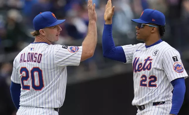 New York Mets' Pete Alonso, left, and Juan Soto, right, celebrate after a baseball game against the Colorado Rockies, Sunday, June 1, 2025, in New York. (AP Photo/Seth Wenig)