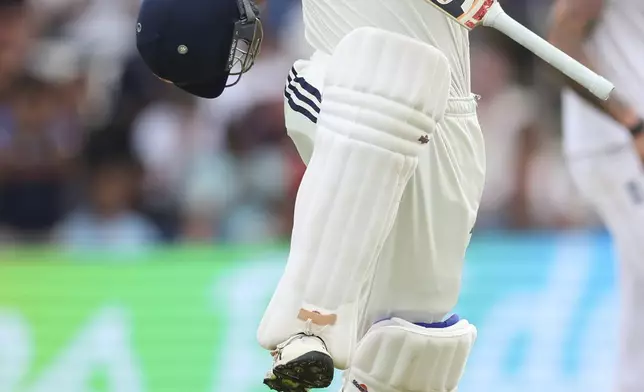 India's Yashasvi Jaiswal celebrates after scoring a century during the play on day one of the first cricket test match between England and India at Headingley in Leeds, England, Friday, June 20, 2025, (AP Photo/Scott Heppell)