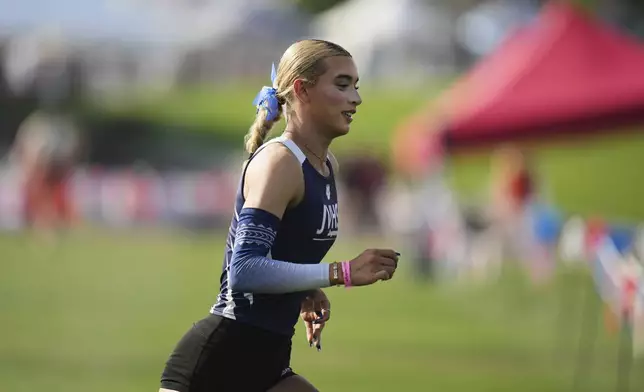 AB Hernandez, a transgender student at Jurupa Valley High School, runs across the field at the California high school track-and-field championships in Clovis, Calif., Saturday, May 31, 2025. (AP Photo/Jae C. Hong)