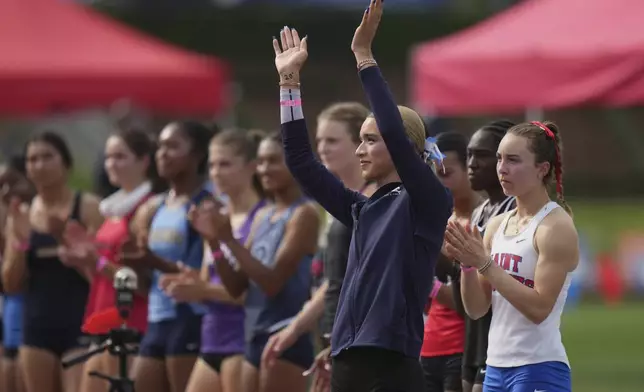 AB Hernandez, a transgender student at Jurupa Valley High School, is introduced before the long jump at the California high school track-and-field championships in Clovis, Calif., Saturday, May 31, 2025. (AP Photo/Jae C. Hong)