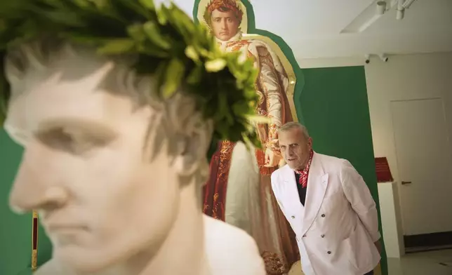 French designer Jean-Charles de Castelbajac poses in an exhibition he created of Napoleon's belongings at the Sotheby's auction house in Paris Thursday, June 19, 2025 in Paris. (AP Photo/Christophe Ena)